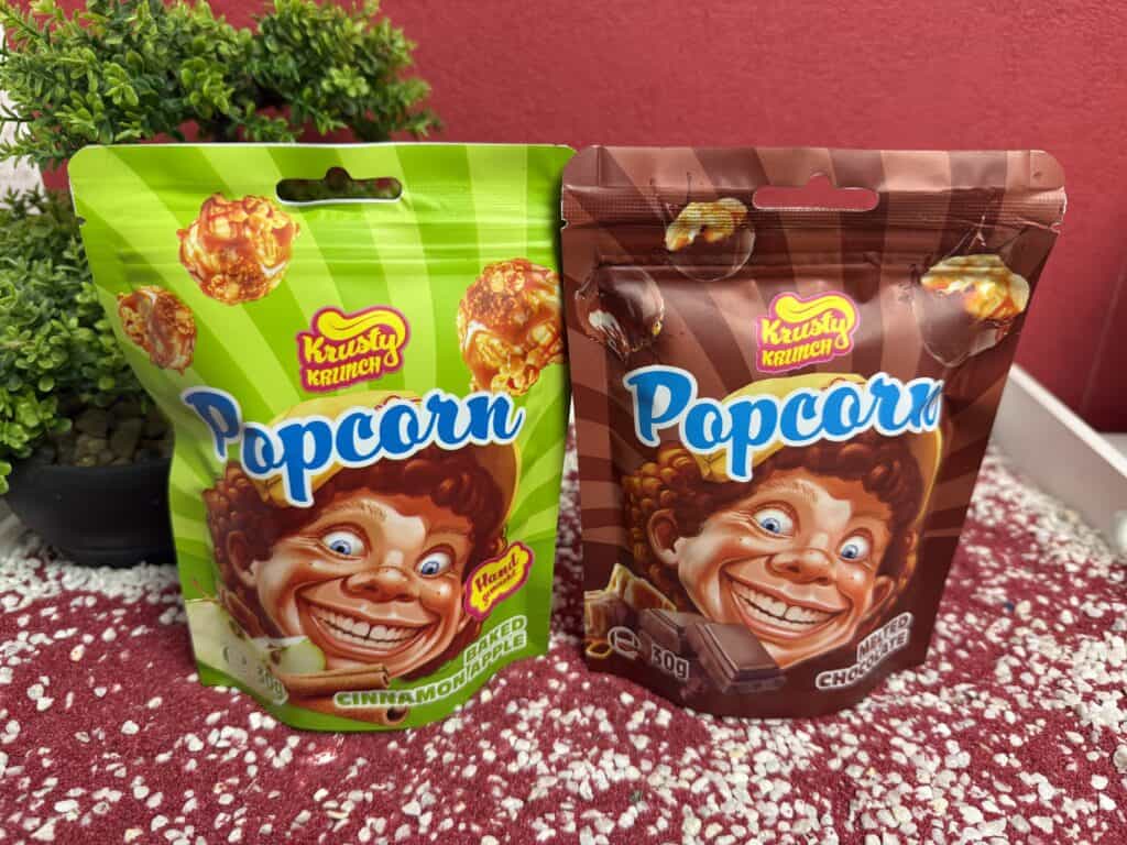 Krusty Krunch Popcorn, die Sorten Schoolade und Apfel Zimt